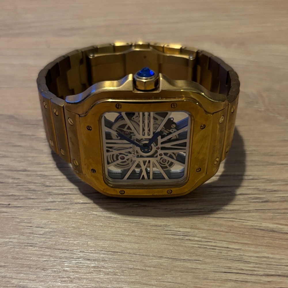 Cartier Gold Watch with Blue Accent